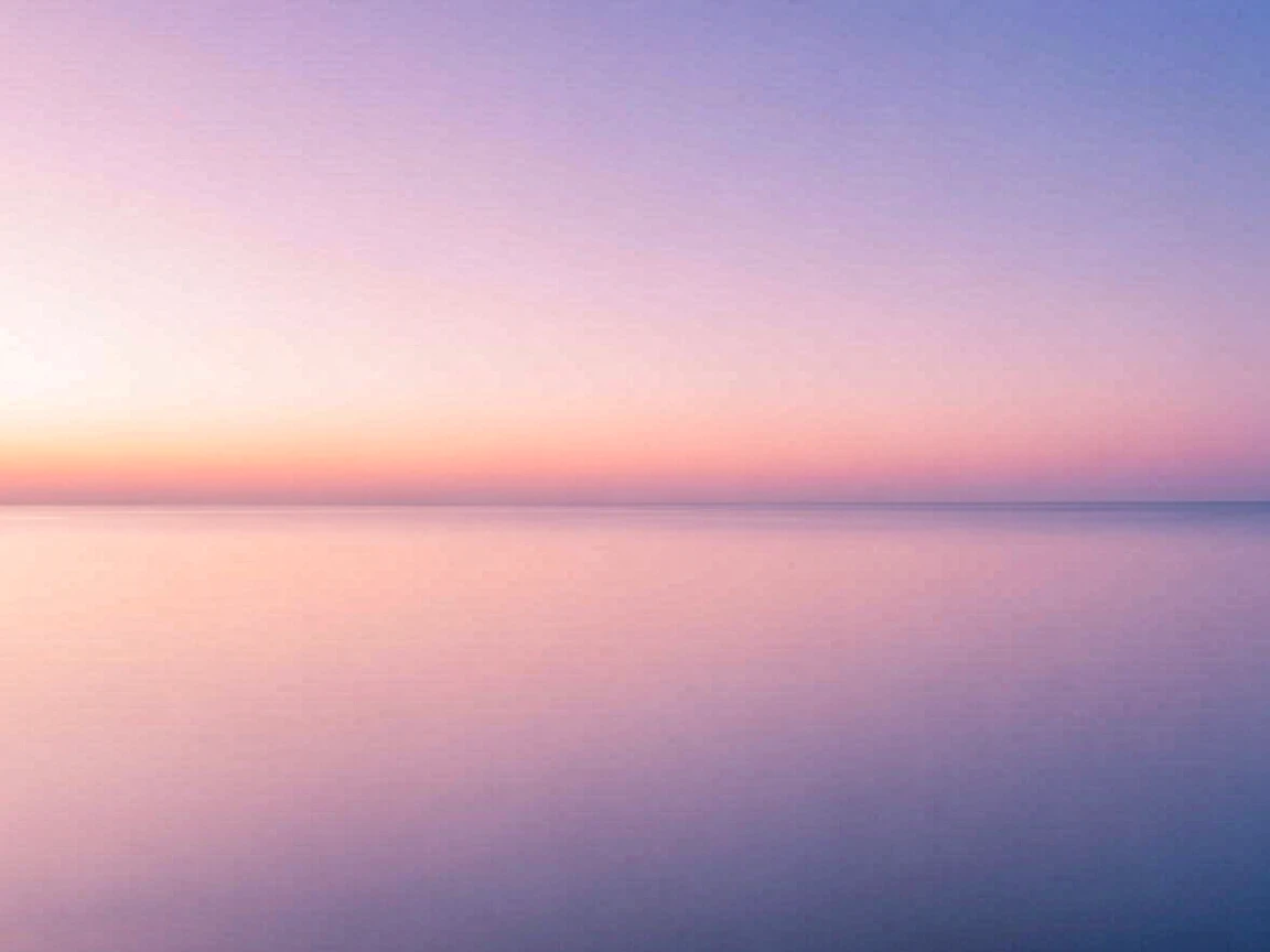 A minimalist gradient background of soft dusk sky colors.